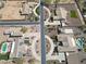 Panoramic aerial view of homes in a planned community featuring circular driveways and desert landscaping at 14507 W Christy Dr, Surprise, AZ 85379