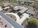 Overhead shot of a beautiful desert home showcasing a circular driveway and a backyard pool at 14507 W Christy Dr, Surprise, AZ 85379