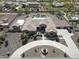 Expansive aerial view of the property showcases the sprawling lot, desert landscaping, pool and surrounding neighborhood at 14507 W Christy Dr, Surprise, AZ 85379