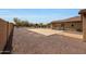 Backyard featuring desert landscaping, a concrete patio, and an outdoor grill area at 14507 W Christy Dr, Surprise, AZ 85379
