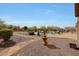 Backyard with fountain, a swimming pool, a patio, an outdoor seating area, and desert landscaping at 14507 W Christy Dr, Surprise, AZ 85379
