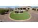 Beautiful backyard featuring a pool, spa, outdoor seating, and low-maintenance desert landscaping at 14507 W Christy Dr, Surprise, AZ 85379