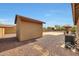 Backyard featuring desert landscaping, concrete patio, and storage shed at 14507 W Christy Dr, Surprise, AZ 85379