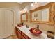 Elegant bathroom with dual vessel sinks, quartz countertops, and decorative mirrors at 14507 W Christy Dr, Surprise, AZ 85379