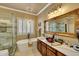 Bright bathroom featuring a soaking tub, vessel sink, and a walk-in shower at 14507 W Christy Dr, Surprise, AZ 85379