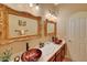 Stylish bathroom with vessel sinks, decorative mirrors, and elegant countertops at 14507 W Christy Dr, Surprise, AZ 85379
