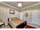 Bedroom featuring carpet, neutral walls, ensuite bathroom with paisley bedspread at 14507 W Christy Dr, Surprise, AZ 85379