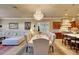 This dining area features a marble table, upholstered chairs, and a crystal chandelier at 14507 W Christy Dr, Surprise, AZ 85379