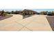 Long driveway leading up to a home with a spacious three-car garage at 14507 W Christy Dr, Surprise, AZ 85379