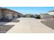 Wide driveway and a three-car garage offer ample parking space at 14507 W Christy Dr, Surprise, AZ 85379