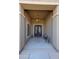 Elegant entryway featuring a chandelier and double doors with wrought iron detailing, creating a grand entrance at 14507 W Christy Dr, Surprise, AZ 85379