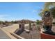 Well-manicured front yard with large driveway and a lion statue at the entrance at 14507 W Christy Dr, Surprise, AZ 85379