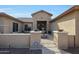 Inviting front entrance with decorative fountain and gated courtyard at 14507 W Christy Dr, Surprise, AZ 85379
