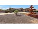 Welcoming front yard featuring desert plants, gravel ground cover, and a prominent water fountain feature at 14507 W Christy Dr, Surprise, AZ 85379