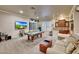 Inviting game room with a pool table, wet bar, comfortable seating, and a large flat-screen TV at 14507 W Christy Dr, Surprise, AZ 85379