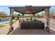 Relaxing gazebo with comfortable seating, offering a perfect spot for outdoor gatherings and enjoying the backyard view at 14507 W Christy Dr, Surprise, AZ 85379