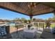 Inviting gazebo with comfortable seating and a view of the sparkling pool, perfect for outdoor relaxation and entertaining at 14507 W Christy Dr, Surprise, AZ 85379