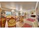 Formal living and dining area with luxurious furnishings, elegant chandeliers, and an open concept design at 14507 W Christy Dr, Surprise, AZ 85379