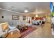 Open concept living room with dining area and kitchen at 14507 W Christy Dr, Surprise, AZ 85379