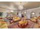 Opulent living room featuring elegant furnishings, ornate details, and a sophisticated ambiance for formal entertaining at 14507 W Christy Dr, Surprise, AZ 85379