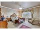 Elegant main bedroom featuring a sitting area, and decorative wall paper at 14507 W Christy Dr, Surprise, AZ 85379