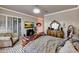 The main bedroom features decorative wallpaper and a view of the backyard at 14507 W Christy Dr, Surprise, AZ 85379