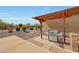 Outdoor kitchen with a built-in grill and desert landscaping at 14507 W Christy Dr, Surprise, AZ 85379