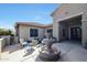 Outdoor patio area with comfortable seating and a charming water fountain at 14507 W Christy Dr, Surprise, AZ 85379