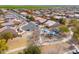 Community aerial view highlighting a park with a playground and walking paths near lovely homes in a quiet neighborhood at 1629 E Prickly Pear Pl, Casa Grande, AZ 85122