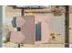 Birds-eye view of property, with solar panels and a backyard featuring low-maintenance rock landscaping for easy upkeep at 1629 E Prickly Pear Pl, Casa Grande, AZ 85122