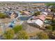 Neighborhood aerial view features well-maintained homes, a community park, and a refreshing neighborhood pool at 1629 E Prickly Pear Pl, Casa Grande, AZ 85122