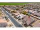 Expansive aerial view showcases a well-maintained neighborhood with a lovely home featuring a red tile roof at 1629 E Prickly Pear Pl, Casa Grande, AZ 85122