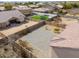Aerial view of a backyard featuring a patio, rock landscaping, and additional backyard green space perfect for activities at 1629 E Prickly Pear Pl, Casa Grande, AZ 85122