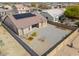 A high aerial view of a home featuring solar panels, rock landscaping, and a block fence for maximum backyard privacy at 1629 E Prickly Pear Pl, Casa Grande, AZ 85122