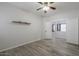 A bright bedroom has a ceiling fan and a view of the adjacent room at 1629 E Prickly Pear Pl, Casa Grande, AZ 85122
