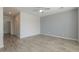 Spacious bedroom with gray wood-look floors at 1629 E Prickly Pear Pl, Casa Grande, AZ 85122