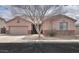 Charming single-story home with well-maintained landscaping and a two-car garage at 1629 E Prickly Pear Pl, Casa Grande, AZ 85122