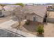 Aerial view highlights the home's architectural details and well-kept landscape at 1629 E Prickly Pear Pl, Casa Grande, AZ 85122