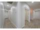Spacious hallway with wood-look tile flooring and neutral paint at 1629 E Prickly Pear Pl, Casa Grande, AZ 85122