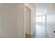 Hallway leading to a bright living area with a view of large windows at 1629 E Prickly Pear Pl, Casa Grande, AZ 85122