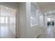 Hallway with arched openings provides a glimpse into the living areas and kitchen at 1629 E Prickly Pear Pl, Casa Grande, AZ 85122