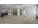 Inviting living room area with views of the kitchen and stylish wood-look floors at 1629 E Prickly Pear Pl, Casa Grande, AZ 85122