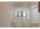Open-concept living area with modern flooring and abundant natural light at 1629 E Prickly Pear Pl, Casa Grande, AZ 85122