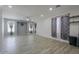 Bright and open living room area with plenty of natural light and stylish wood-look floors at 1629 E Prickly Pear Pl, Casa Grande, AZ 85122