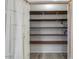 A bright pantry with adjustable wood shelves provides ample storage space at 1629 E Prickly Pear Pl, Casa Grande, AZ 85122