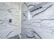 Elegant shower design showcasing marble-style tiling and a convenient shower niche at 1629 E Prickly Pear Pl, Casa Grande, AZ 85122