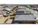 Aerial view of a desert home with solar panels, patio, artificial turf, and desert landscaping at 16430 W Alameda Rd, Surprise, AZ 85387