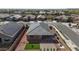 Aerial view of a house with a fenced-in yard, desert landscaping, and neighboring homes at 16430 W Alameda Rd, Surprise, AZ 85387