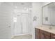 Modern bathroom featuring glass-enclosed shower, white vanity, and updated fixtures at 16430 W Alameda Rd, Surprise, AZ 85387