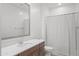 Modern bathroom featuring wood vanity, quartz counters, and bright white paint at 16430 W Alameda Rd, Surprise, AZ 85387